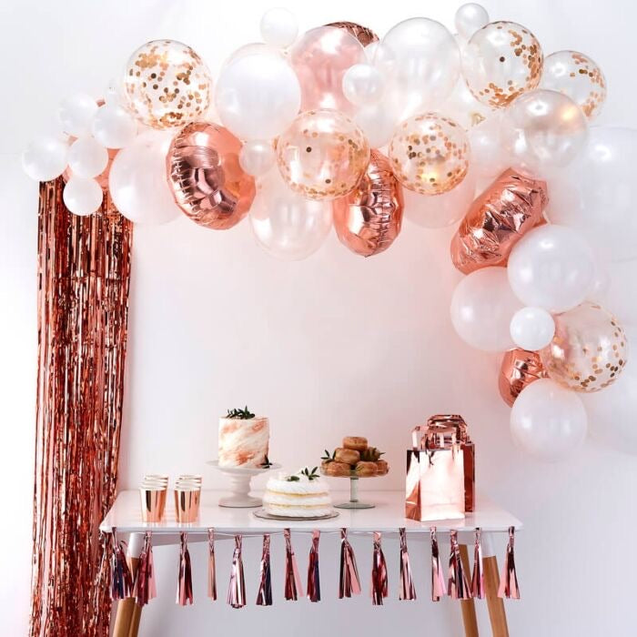 Rose gold bachelorette party balloon arch